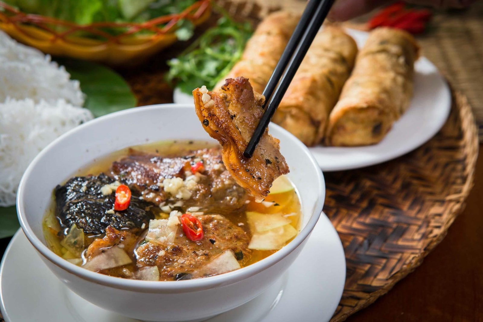Grilled pork served with vermicelli noodles and aromatic dipping sauce